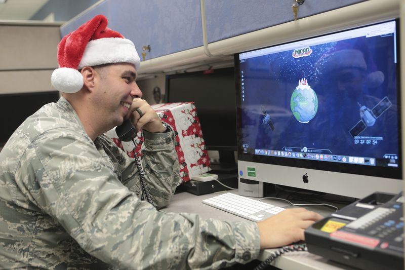 Maj. Jared Scott, makes sure NORAD's Santa tracker is working correctly at Tyndall Air Force Base on Friday, Dec. 23, 2016 in Panama City, Fla. (Heather Howard/News Herald via AP)