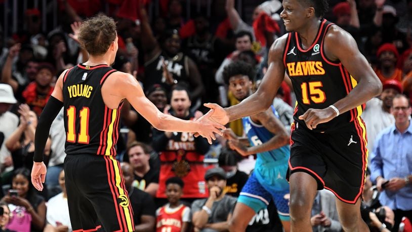 Hawks guard Trae Young (11) and center Clint Capela will be back on the court in October. Here is a breakdown of the Hawks' 2022-23 NBA schedule, which was released Wednesday. (Hyosub Shin / Hyosub.Shin@ajc.com)