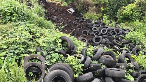 Tires litter the Old Atlanta Prison Farm in May.
