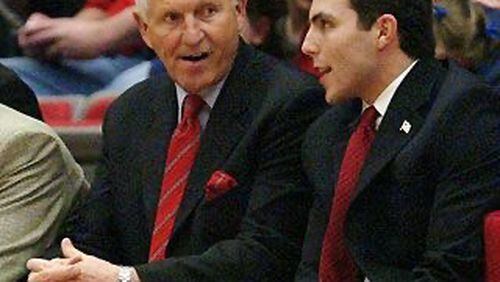 Georgia Tech coach Josh Pastner (right) confers on the bench with coaching legend Lute Olson (left) during Pastner's time as an Arizona assistant coach.