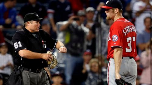 Nationals pitcher Stephen Strasburg was ejected by umpire Marvin Hudson for throwing consecutive pitches behind the Braves' Andrelton Simmons.