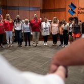 210520-Canton-People gather for a prayer before the beginning of the Cherokee County School Board on Thursday night, May 20, 2021. Ben Gray for the Atlanta Journal-Constitution