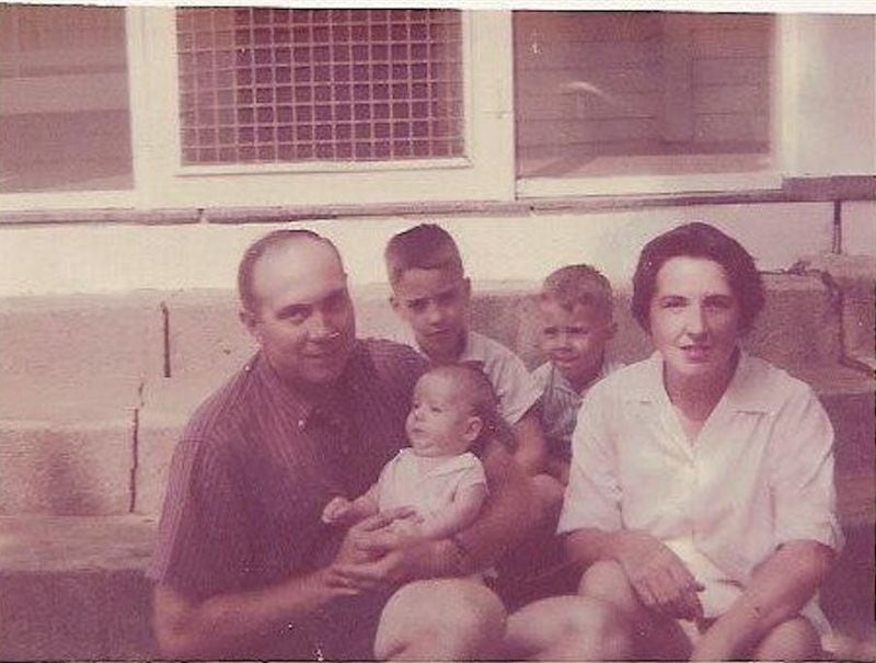 The King boys, Bill (second from left), Jonathan (center) and Timothy (in his father’s arms), sit with their parents, William D. King and Mollie Parry King, on their grandmother’s front steps. (Courtesy of the King family)