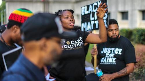 Earlier this year there was a protest at the Fulton County Justice Center aimed at bringing attention to the number of black men killed by police. CREDIT: JOHN SPINK /JSPINK@AJC.COM