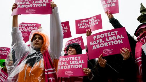 Abortion rights demonstrators gather at the Michigan Capitol, in Lansing, on May 3 after the publication the day before of a leaked draft of a Supreme Court opinion that would overturn Roe v. Wade. MUST CREDIT: Photo by Brittany Greeson for The Washington Post.