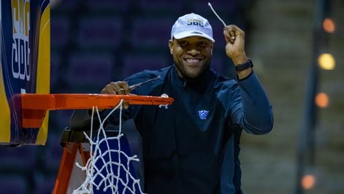Jarvis Hayes, here cutting down the net after Georgia State won the 2022 Sun Belt Conference Tournament in Pensacola, Fla, has been retained on the staff by new coach Jonas Hayes, his twin brother.