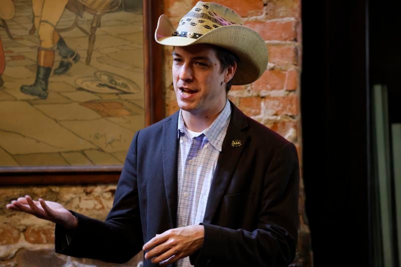 Some of Gov. Brian Kemp's supporters are backing Libertarian Senate candidate Chase Oliver over Republican Herschel Walker. (Miguel Martinez / AJC)