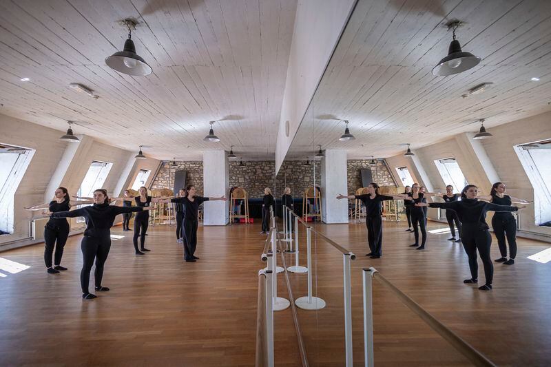 Horsewomen attend a dance training session at the Academie du Spectacle Equestre, in the royal stables, in Versailles, Thursday, April 25, 2024. More than 340 years after the royal stables were built under the reign of France's Sun King, riders and horses continue to train and perform in front of the Versailles Palace. The site will soon keep on with the tradition by hosting the equestrian sports during the Paris Olympics. Commissioned by King Louis XIV, the stables have been built from 1679 to 1682 opposite to the palace's main entrance. (AP Photo/Aurelien Morissard)