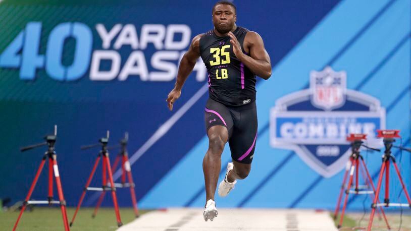 Georgia linebacker Roquan Smith runs the 40-yard dash at the NFL football scouting combine in Indianapolis, Sunday, March 4, 2018. (AP Photo/Michael Conroy)