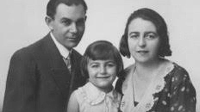 Magda Mozes Herzberger as a child in Romania with her parents, Herman and Serena Mozes. CONTRIBUTED