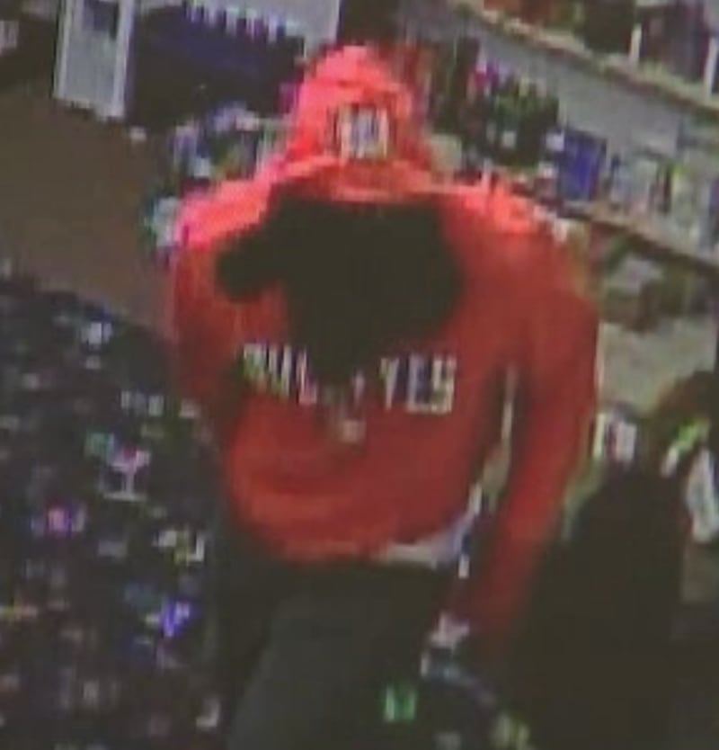 This man in a red Ohio State Buckeyes hoodie is wanted by police.