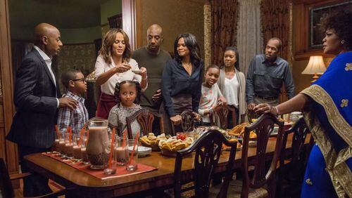 There's not much peace on earth happening around the family dinner table in locally filmed "Almost Christmas." Photo: Universal Pictures