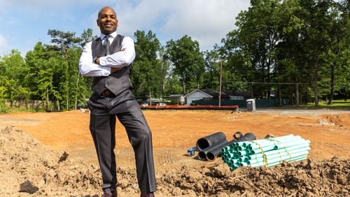 Darion Dunn, managing partner of Atlantica Properties, poses for a portrait at the site of a future 16-unit townhome project in Forest Park on Tuesday, May 16, 2023. (Arvin Temkar / arvin.temkar@ajc.com)