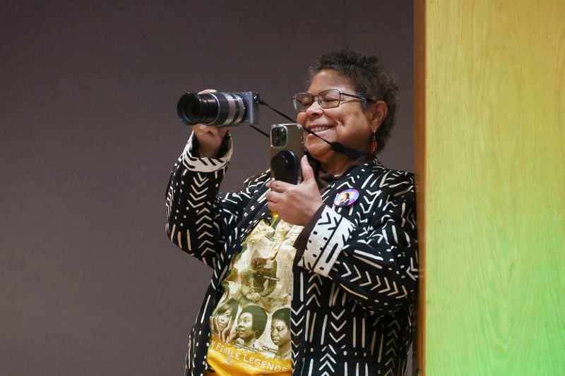 Sue Ross photographs the press conference on the passing of Dexter Scott King, son of the Rev. Martin Luther King, Jr. at the Yolanda D. King Theatre for the Performing Arts, Tuesday, January 23, 2024. This “photo-griot” specializes in documenting cultural, political,  social, and economic images of the African-American community.  (Jason Getz/jason.getz@ajc.com)