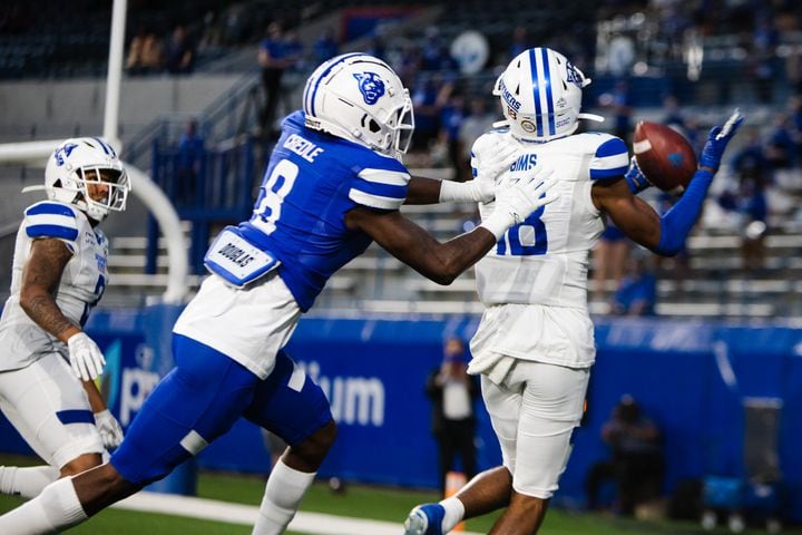Cameron Sims (18), white team cornerback, attempts to make a catch under pressure from Jaquez Pennimon (8), blue team safety, during the Georgia State University spring football game on Friday, April 16, 2021, at Center Parc Stadium in Atlanta. The white team defeated the blue team 23-17. CHRISTINA MATACOTTA FOR THE ATLANTA JOURNAL-CONSTITUTION