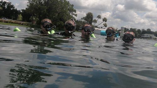 From left, Nicky Christiansen, Mike Christiansen Sr., Mike Christiansen Jr., Kathleen Christiansen and Anthony Christiansen go on a Manatee Tour and Dive manatee snorkeling tour on July 21, 2018, in Kings Bay in Crystal River. (Kathleen Christiansen/Orlando Sentinel/TNS)