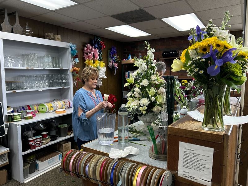 Jan Hudgins, co-owner of the flower shop Flowerland in Athens, Georgia, prepares bouquets on Friday Feb. 23, 2024 to be sent to the sorority of nursing student Laken Riley, who was found dead on the University of Georgia campus on Thursday.