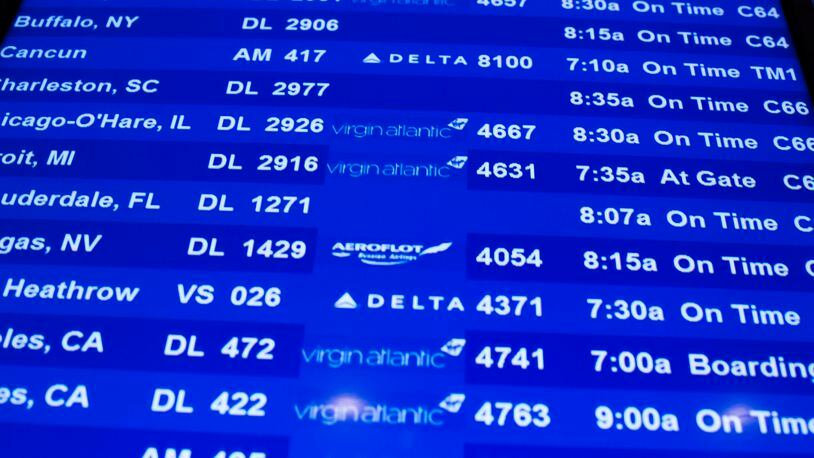 A flight information board is displayed at John F. Kennedy International Airport in New York. REUTERS/Lucas Jackson