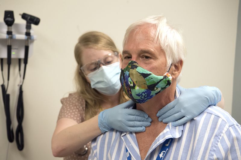 Jack Krost participates in Phase 3 of the COVID-19 vaccine trial at Emory University’s Hope Clinic. He’s with Laura Clegg, clinical research nurse at the Hope Clinic.