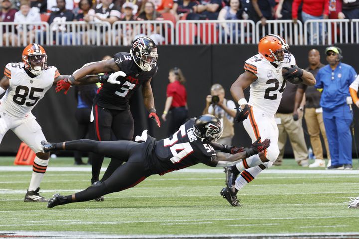 Falcons linebacker Rashaan Evans (54) tries to stop Browns running back Nick Chubb during the third quarter Sunday in Atlanta. (Miguel Martinez / miguel.martinezjimenez@ajc.com)