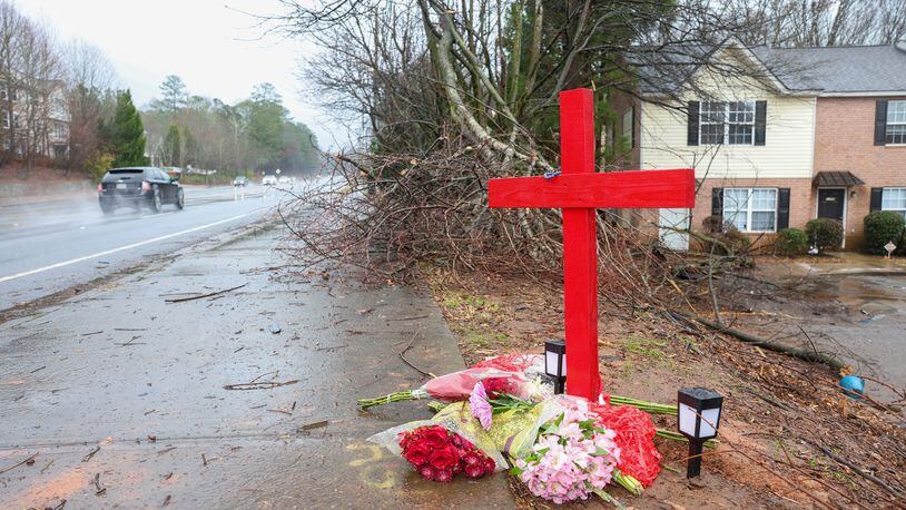 A memorial for University of Georgia football player Devin Willock and UGA football staff member Chandler LeCroy at the site where their automobile crashed on Barnet Shoals Road on Jan. 19, 2023, in Athens, Georgia. Willock and LeCroy died from their injures. (Jason Getz/The Atlanta Journal-Constitution/TNS)