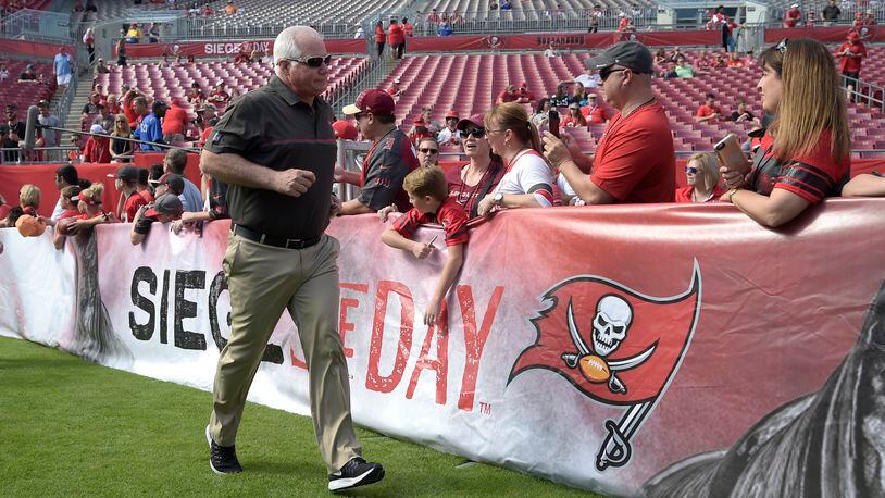 Tampa Bay Buccaneers defensive coordinator Mike Smith walks onto the field during warmups before an NFL football game against the Carolina Panthers in Tampa, Fla., Sunday, Jan. 1, 2017. (AP Photo/Phelan M. Ebenhack)