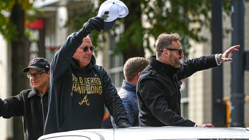 Braves radio announcers Joe Simpson (left) and Ben Ingram wave to fans during the championship parade for the 2021 World Champions on November 05, 2021, on Peachtree Street. (Photo by John Adams/Icon Sportswire)
