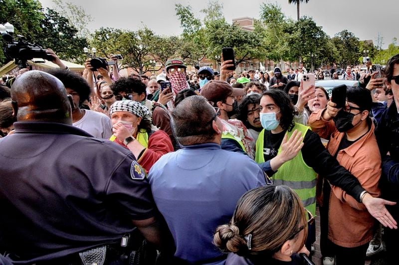 University of Southern California protesters confront University Public Safety officers as tempers get heated during a pro-Palestinian occupation on the University of Southern California campus Wednesday, April 24, 2024 in Los Angeles. (AP Photo/Richard Vogel)