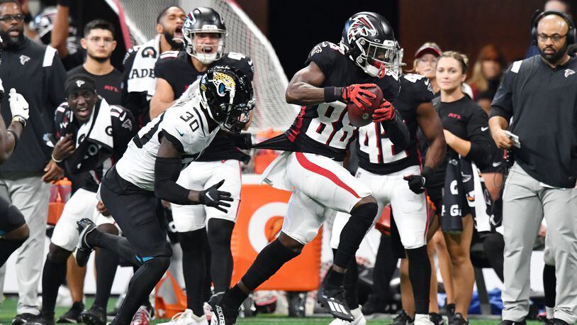 Falcons wide receiver Frank Darby (88) makes a move after catching a pass as Jacksonville Jaguars' cornerback Montaric Brown (30) tries to stop during the second half of at Mercedes-Benz Stadium in Atlanta at on Saturday, Aug. 27, 2022. (Hyosub Shin / Hyosub.Shin@ajc.com)