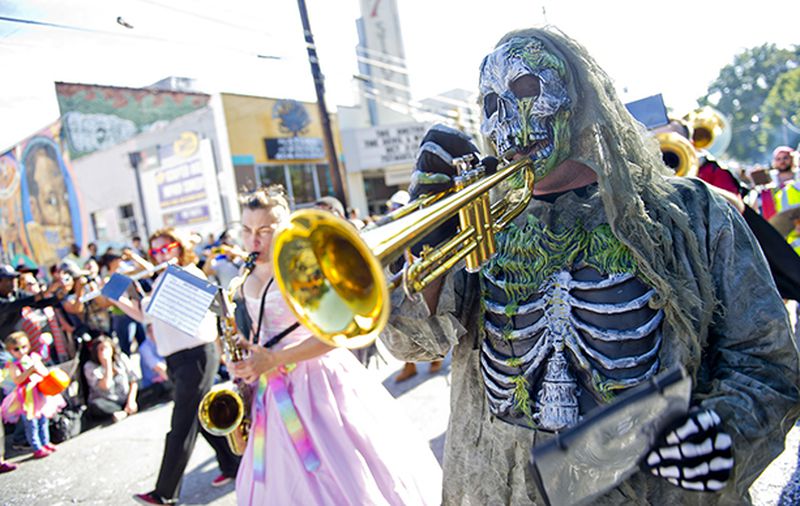 October 18, 2014 Atlanta - Christopher Manson (right) plays the trumpet as he marches in the 14th annual Little 5 Points Halloween Parade in Atlanta on Saturday, October 18, 2014. Thousands of people lined the streets to watch the parade which featured local haunted attractions, bands and floats. JONATHAN PHILLIPS / SPECIAL
