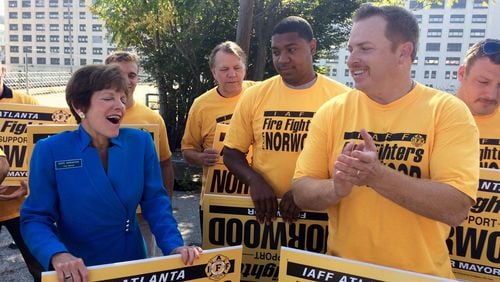 Atlanta City Councilwoman Mary Norwood, left, and International Association of Fire Fighters Local 134 President Paul Gerdis speak during a campaign event Tuesday, Sept. 19, 2017. The IAFF endorsed Norwood in her run for mayor. STRUBEY/AJC