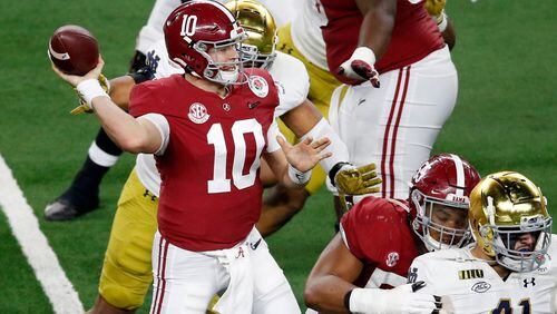 Alabama quarterback Mac Jones (10) throws from the pocket in the second half of the Rose Bowl NCAA college football game against Notre Dame in Arlington, Texas, Friday, Jan. 1, 2021. (AP Photo/Roger Steinman)