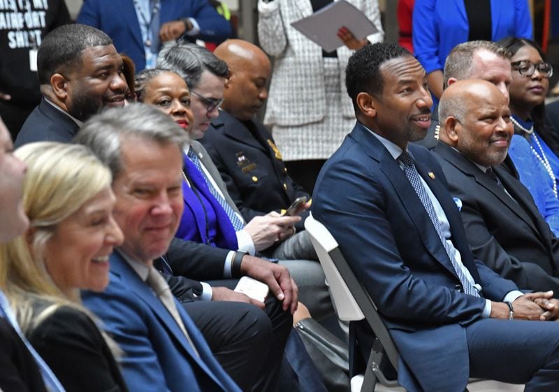 Speakers at an event in Atlanta on Tuesday, Jan. 31, included Atlanta mayor Andre Dickens (center right) and Gov. Brian Kemp (center left). (Hyosub Shin/The Atlanta Journal-Constitution)