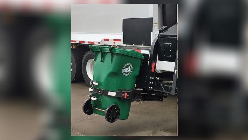 The robot-like arm can grab the garbage bins.