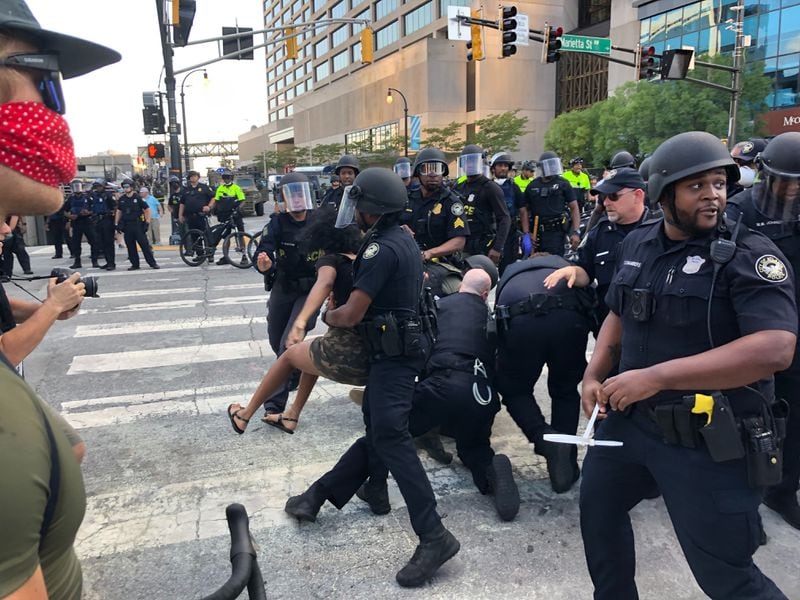 Police arrested several people who appeared to be throwing bottles of water in downtown Atlanta Saturday, May 30. 2020. 