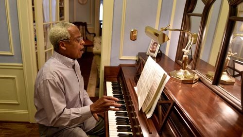 Sam Hagan, a retired biology teacher and a dedicated home improver, built a second career as a vocalist. Here he glances at a piece of music he would sing in the 40th annual “Messiah” presented at St. Luke’s Episcopal Church. BRANT SANDERLIN/BSANDERLIN@AJC.COM