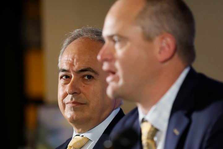 Georgia Tech's new football head coach Brent Key (right) answers questions from the media during his introductory news conference as Tech President Angel Cabrera looks on Monday, Dec. 5, 2022.
 Miguel Martinez / miguel.martinezjimenez@ajc.com