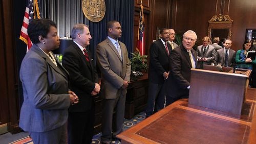 Gov. Nathan Deal announces the six new members of the DeKalb School Board on Wednesday.