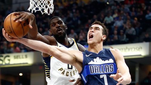 Dwight Powell  of the Dallas Mavericks has his shot blocked by Alex Poythressof the Indiana Pacers during the game at Bankers Life Fieldhouse on December 27, 2017 in Indianapolis, Indiana.