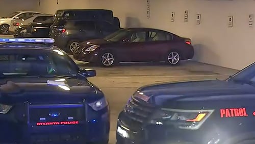 Police are investigating after a woman was found shot to death in the parking garage of the Mark at West Midtown apartment complex Tuesday evening.