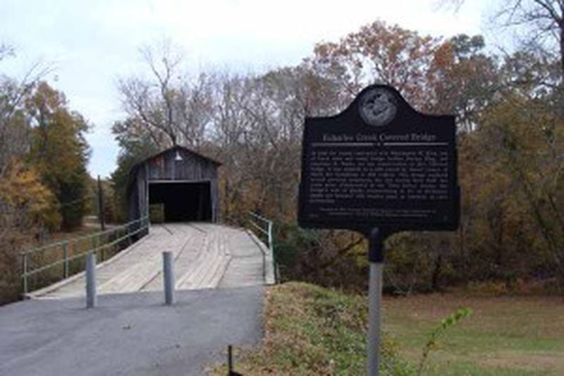 In 2000, the Georgia Historical Society set up a marker in Bartow County, noting the history of this bridge across Euharlee Creek built by Washington W. King in 1886. King was the son of freed slave and noted bridge builder Horace King. It was adjacent to a mill owned by Daniel Lowery, of which the foundation is still evident. This bridge replaced several previous structures, the last having been built two years prior. Constructed in the Town lattice design, the bridge’s web of planks crisscrossing at 45- to 60-degree angles are fastened with wooden pegs, or tunnels, at each intersection. Photo courtesy of the Georgia Historical Society.