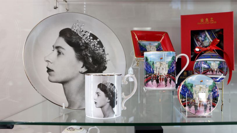 Taste of Britain in Norcross is the go-to place for anything British. With the death of Queen Elizabeth, it’s also a place where shoppers can buy an array of queen-themed merchandise. (Jason Getz / Jason.Getz@ajc.com)