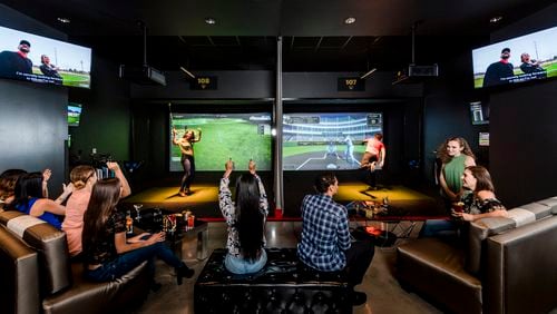 The Topgolf Swing Suite bays offer a variety of virtual games – including the popular Topgolf target game, zombie dodgeball, hockey shots, baseball pitching, carnival classic and more. Credit: Delaware North