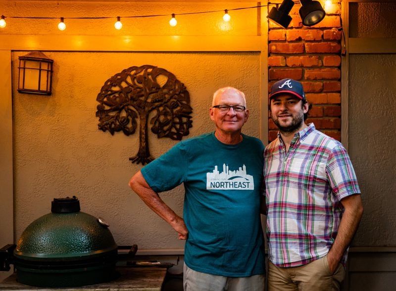 Rob Hollis (left) with Henri Hollis, next to their family’s Big Green Egg. CONTRIBUTED BY HENRI HOLLIS