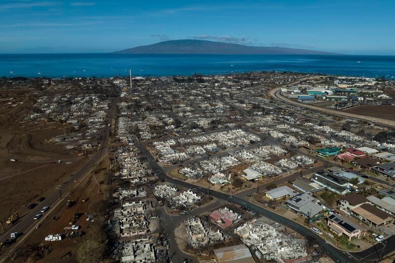 FILE - A general view shows the aftermath of a wildfire in Lahaina, Hawaii, Thursday, Aug. 17, 2023. Maui County is suing major cellular carriers for failing to properly inform police of widespread service outages during the height of last summer's deadly wildfire. (AP Photo/Jae C. Hong, File)