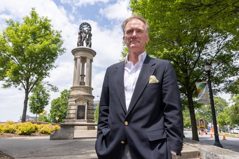 Rodney Cook stands in front of a statue of in Atlanta Tuesday, April 25, 2023.  (Steve Schaefer/steve.schaefer@ajc.com)