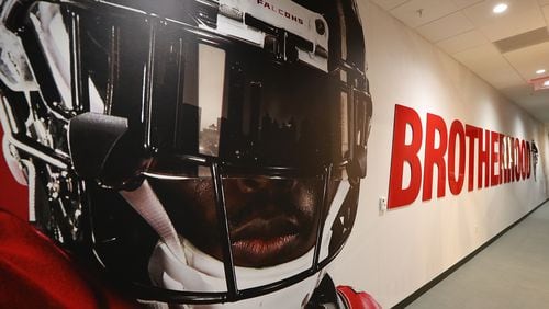 The hallway into the Falcons locker room bears the Brotherhood logo at Mercedes-Benz Stadium during an open house tour on Monday, August 15, 2017, in Atlanta.  Curtis Compton/ccompton@ajc.com
