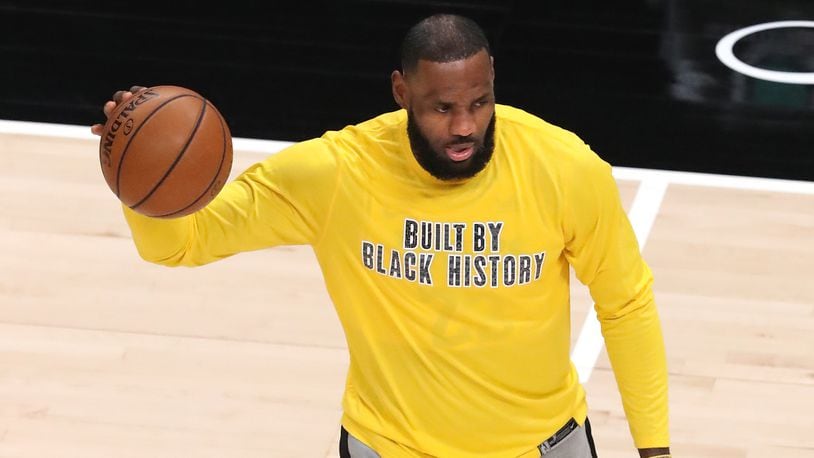 Los Angeles Lakers forward LeBron James - in a T-shirt that reads: "Built by Black History" - warms up before game against the Atlanta Hawks Monday, Feb.1, 2021, at State Farm Arena in Atlanta. (Curtis Compton / Curtis.Compton@ajc.com)