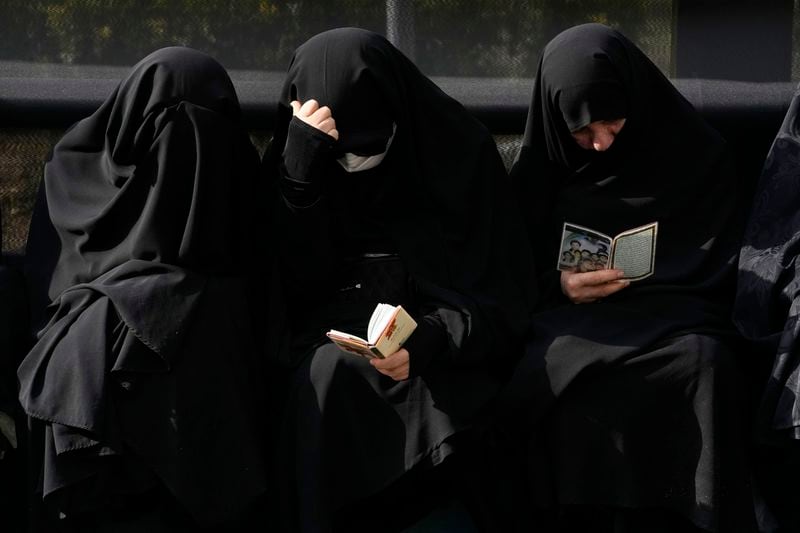 Iranian women attend a mourning ceremony for President Ebrahim Raisi at Vali-e-Asr square in downtown Tehran, Iran, Monday, May 20, 2024. Iranian President Raisi and the country's foreign minister were found dead Monday hours after their helicopter crashed in fog, leaving the Islamic Republic without two key leaders as extraordinary tensions grip the wider Middle East. (AP Photo/Vahid Salemi)