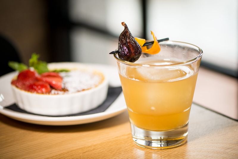 Figgy Fashioned Cocktail with Bullet Rye, house made fig syrup, orange bitters, dried fig, and an orange twist. Photo credit- Mia Yakel.